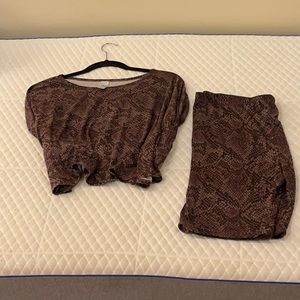 Black and brown, animal print, matching set; shorts and a crop top.